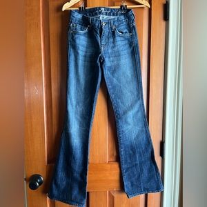 7 For All Man Kind denim low rise bootcut Jean. Woman’s Size 24